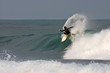 Surfer kickback on a wave.