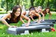 young and attractive people doing fitness exercises