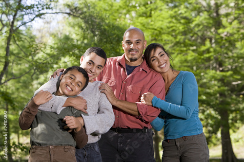 Photo: Portrait of Hispanic family with two boys outdoors Portrait of Hispanic family with two boys outdoors