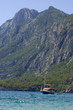 Beautiful sea landscape. The boat against rocky coast.