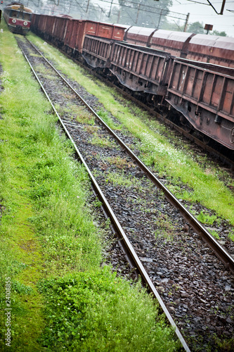 Photo: Cargo wagons in the train station during rain Cargo wagons in the train station during rain