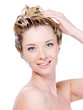 Smiling woman washing head - isolated on white Smiling woman washing head - isolated on white
