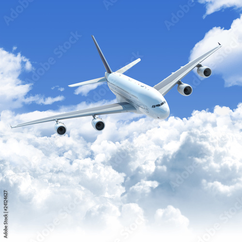Photo: airplane flying over the clouds front top view airplane flying over the clouds front top view