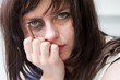 Upset young woman with a bruised black-eye