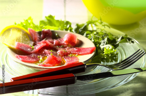 Photo: carpaccio of tuna marinated in olive oil with peppers and mixed rocket lettuce carpaccio of tuna marinated in olive oil with peppers and mixed rocket lettuce