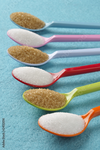 Photo: plastic spoons with white and brown sugar plastic spoons with white and brown sugar