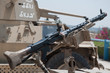 Machine gun mounted on top of the turret .