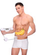 Man with bathroom scales and banana Man with bathroom scales and banana