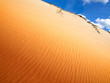 Sahara Desert Sand Dunes Against Blue Sky