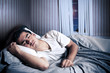 Man comfortably sleeping in his bed