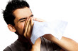 A young man having a cold or allergy.