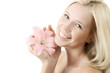 Beautiful blond smiling woman with pink lily isolated on white Beautiful blond smiling woman with pink lily isolated on white