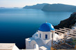 Church in OIa on Island of Santorini with bay view of Volcano