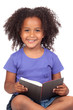 Student little girl reading with a book