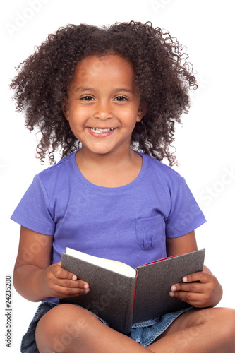 Photo: Student little girl reading with a book Student little girl reading with a book