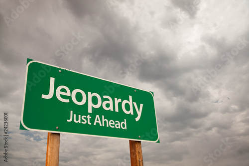 Photo: Jeopardy Green Road Sign Over Storm Clouds Jeopardy Green Road Sign Over Storm Clouds