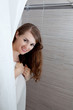 dressed in towel gorgeous woman taking a shower