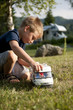 Photo: Little boy playing at camping site Little boy playing at camping site