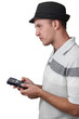 A young man with a calculator.
