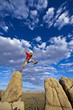 Climber jumping across gap.
