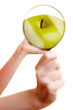 Hand mit Lupe und Apfel Hand mit Lupe und Apfel