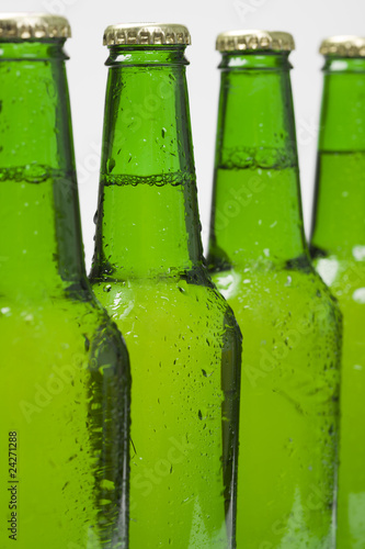 Beer bottles isolated on white background closeup Beer bottles isolated on white background closeup