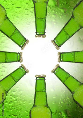 Beer bottle isolated on green background in shape of the sun
