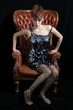Beautiful model, photographed sitting on a big Chair
