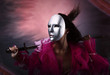 Woman warrior in a silver mask with a sword in hands.