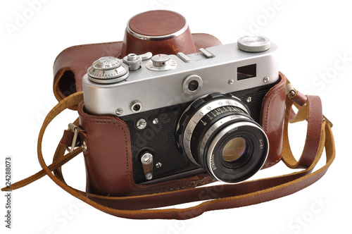Photo: Isolated used old-fashioned film photo-camera in leather case Isolated used old-fashioned film photo-camera in leather case