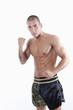 Sexy muscle young man with muay thai gloves
