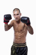 Sexy well trained male with muay thai gloves