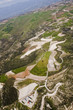 Aerial view at farm fields in front of misty mountains Aerial view at farm fields in front of misty mountains