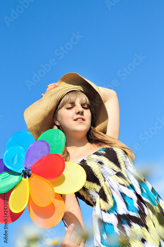 Photo: girl with bright toy girl with bright toy