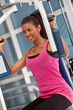 Woman at the gym exercising