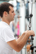 Man at the gym exercising