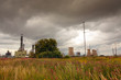 Oil rafinery against stormy clouds