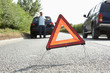 Driver Broken Down On Country Road With Hazard Warning Sign Driver Broken Down On Country Road With Hazard Warning Sign
