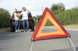 Photo: Family Broken Down On Country Road With Hazard Warning Sign Family Broken Down On Country Road With Hazard Warning Sign