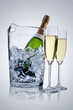 Photo: Champagne in a ice bucket and two champagne flutes Champagne in a ice bucket and two champagne flutes