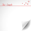White paper with corner curl and text space