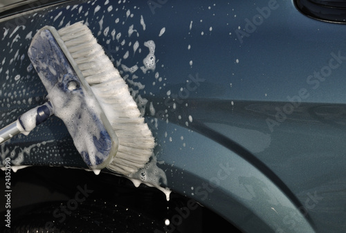 Photo: Washing Car with Scrub Brush Washing Car with Scrub Brush