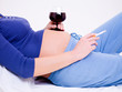 Pregnant woman with a glass of wine