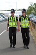 Two British Police Constables on patrol and in uniform
