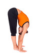 Photo: Woman Practicing Standing Forward Bend Yoga Exercise Woman Practicing Standing Forward Bend Yoga Exercise