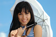 Portrait of the young happy girl with an umbrella