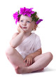 Foto: girl in a wreath of pink flowers girl in a wreath of pink flowers
