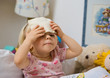 little girl in bed with fever