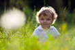 Little baby in the midle of green nature