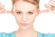 woman with fingers in ears